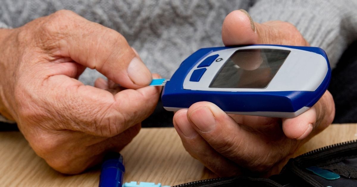 A senior man has to monitor his blood sugar due to diabetes.