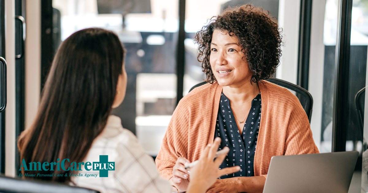 A woman interviews another woman for a caregiver job position.