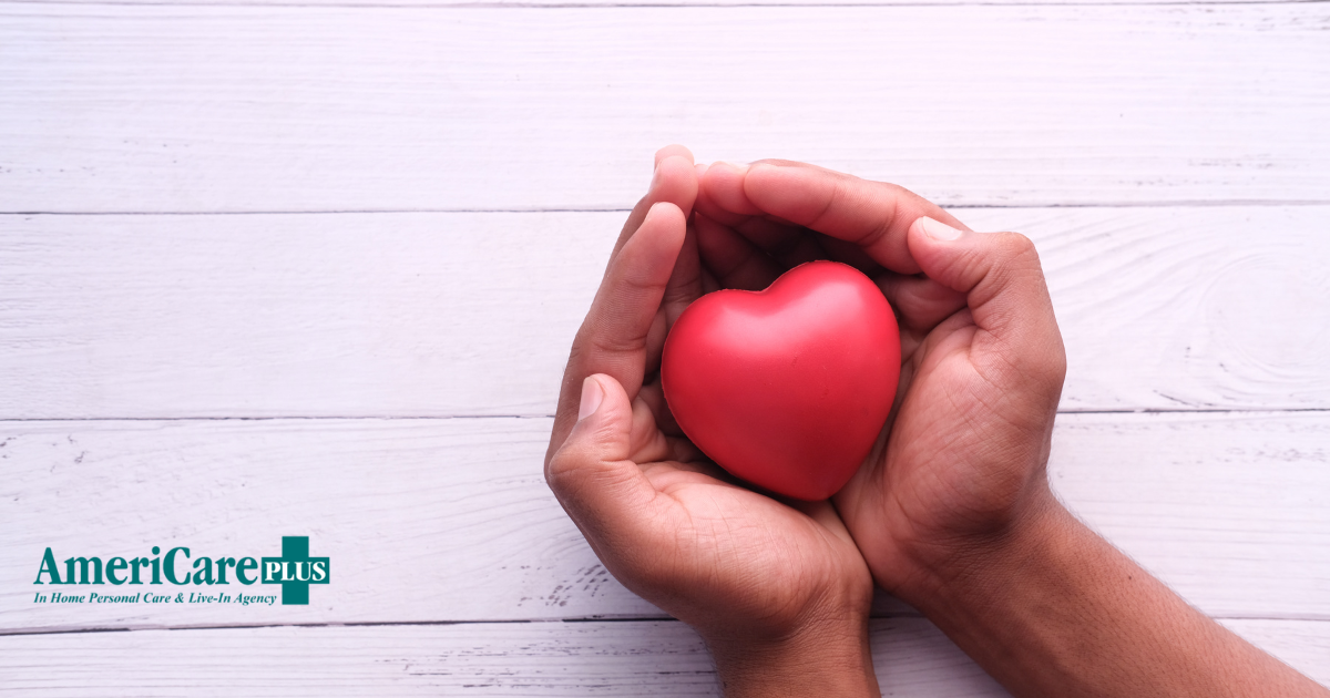 Hands holding a heart shape represent the care and support that those caring for seniors at home need.