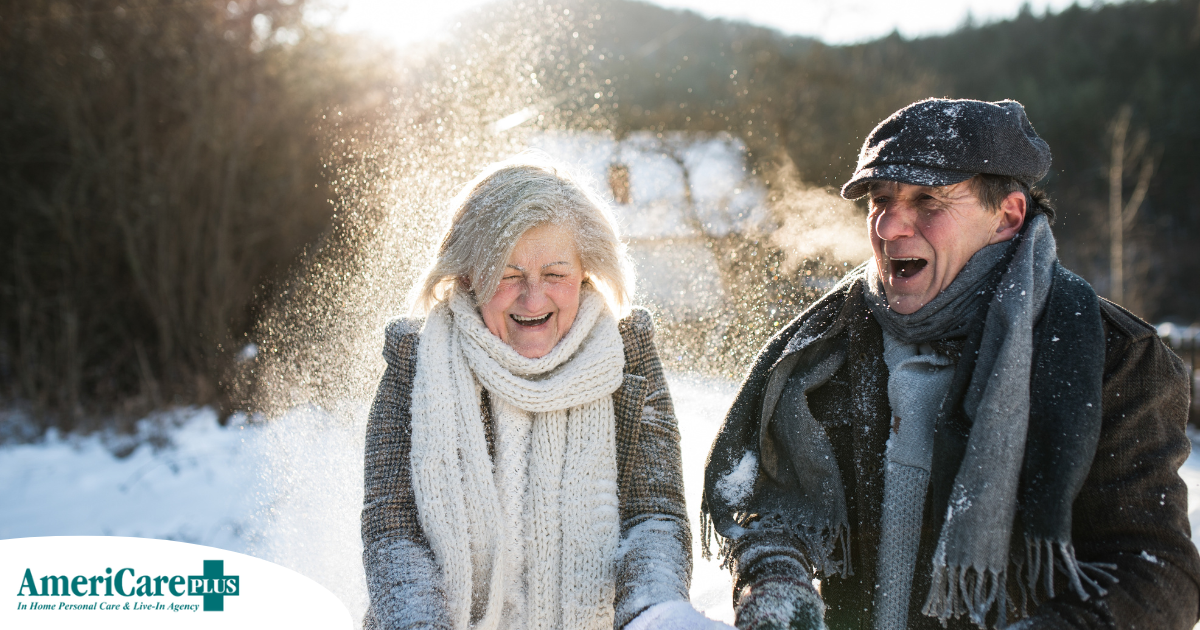 As a result of good winter safety practices, an elderly couple can enjoy time outside in the snow.
