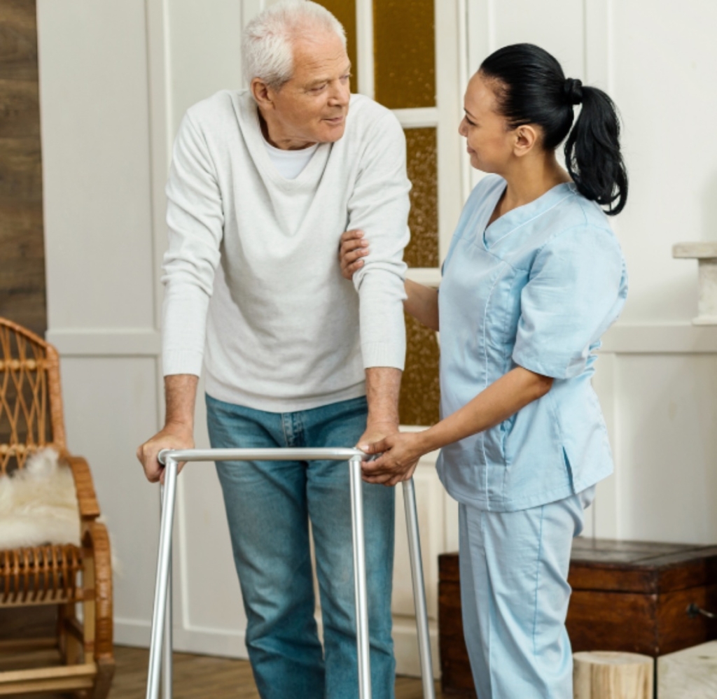 A caregiver helping a senior client get around represents Post Operative Care in Mecklenburg