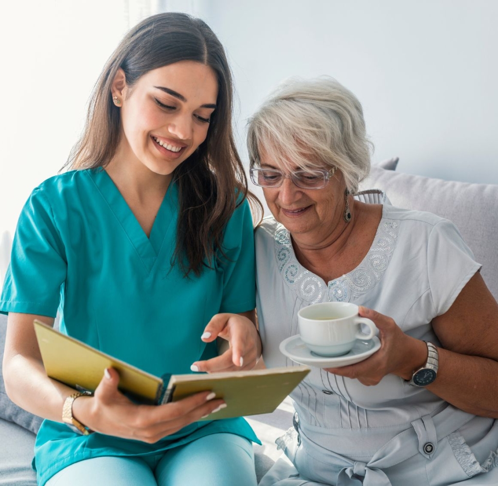 A caregiver reads with a senior client representing quality Respite Care in Mecklenburg