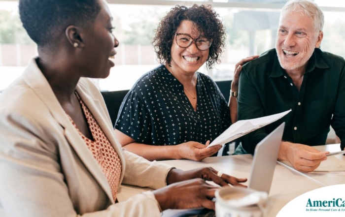 A couple talks with and advisor, representing the type of preparation that is crucial for successful senior care planning.