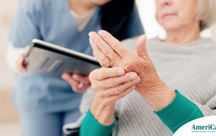 A caregiver provides in home care services to a senior with arthritis