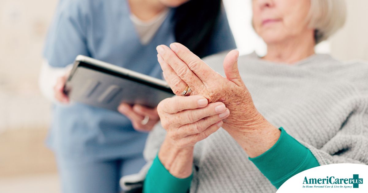 A caregiver provides in home care services to a senior with arthritis