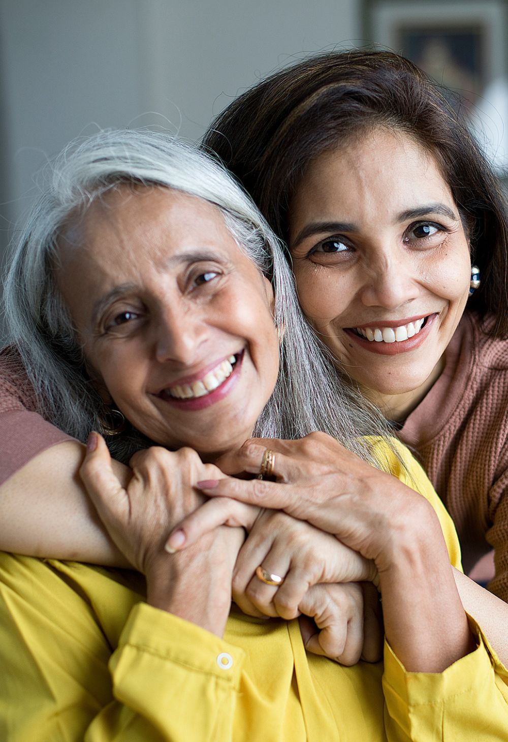Home Care in Mathews, VA (1) Caregiver embracing a senior woman, reflecting Home Care in Mathews