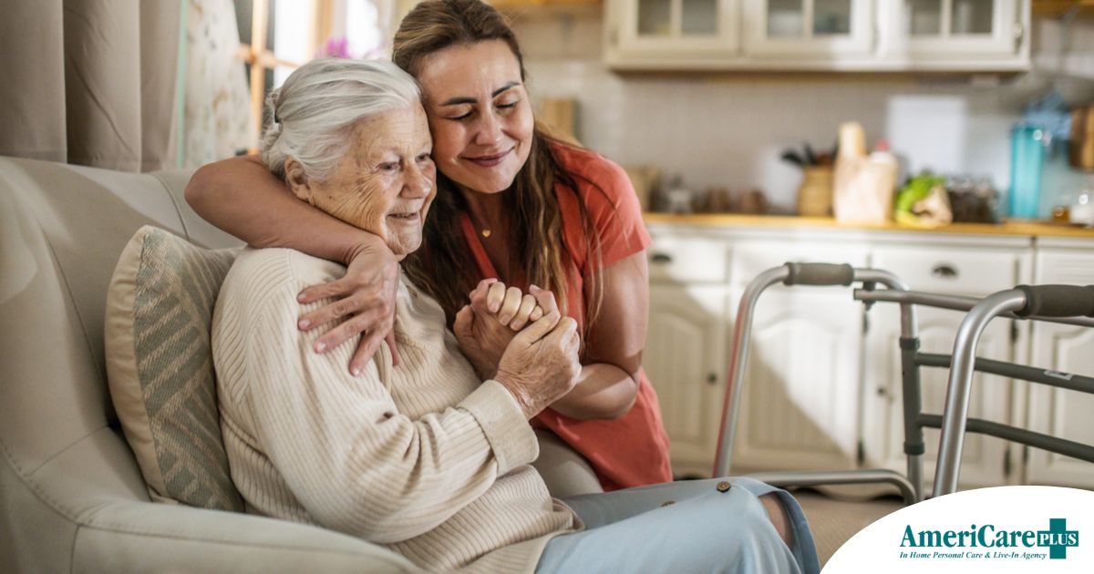 Caregiver supporting an elderly woman in the transition to senior home care