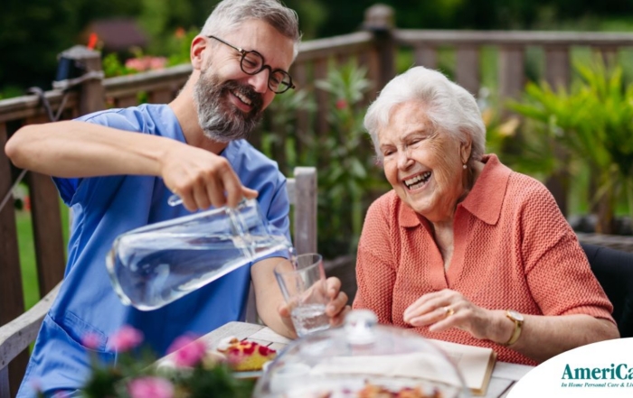 A caregiver applies summer Caregiving Tips including helping a senior stay hydrated.